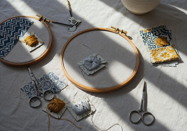 artist stitching embroidery on hoop